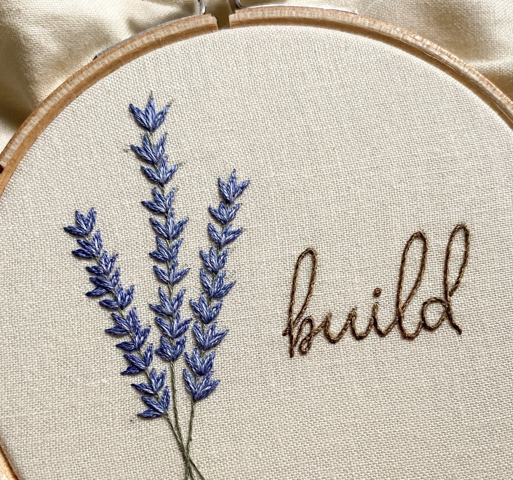embroidery hoop with lavender and the word build